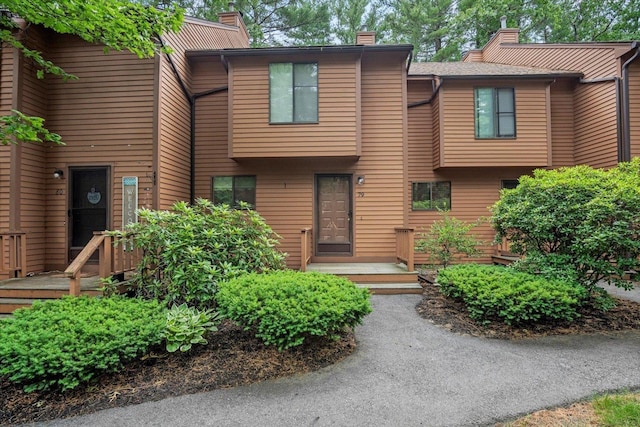 79 Dunvegan Woods Dr Unit 79, Hampton, NH 03842 - view of front of home featuring a chimney