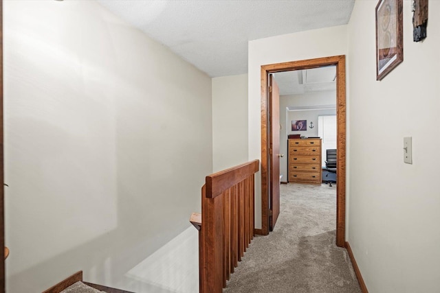 79 Dunvegan Woods Dr Unit 79, Hampton, NH 03842 - corridor featuring an upstairs landing, carpet floors, and a textured ceiling