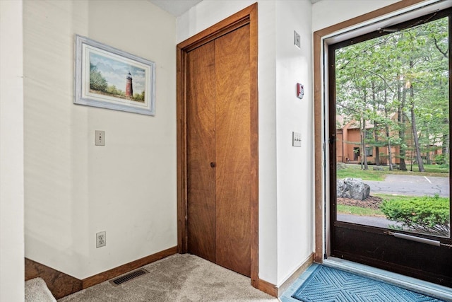 79 Dunvegan Woods Dr Unit 79, Hampton, NH 03842 - carpeted foyer featuring baseboards