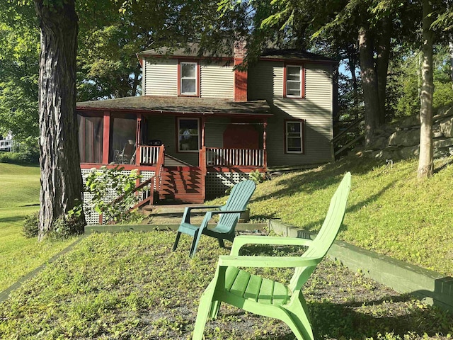 1056 Point Of Pines Rd, Castleton, VT 05735 - rear view of house featuring a yard and a porch