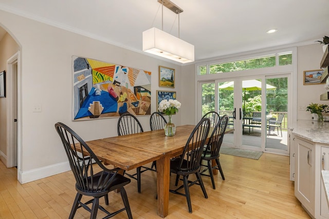 201 Walker Bungalow Rd, Portsmouth, NH 03801 - dining space featuring arched walkways, crown molding, light wood-type flooring, french doors, and recessed lighting