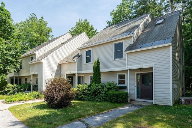 129 Fisherville Rd Unit 26, Concord, NH 03303 - view of front of property featuring a standing seam roof, a front lawn, and a metal roof