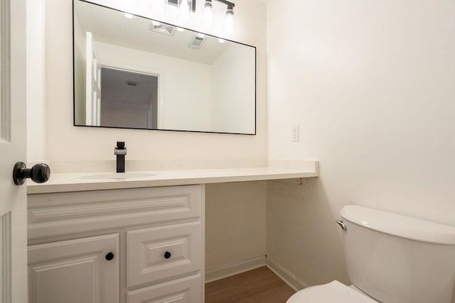 129 Fisherville Rd Unit 26, Concord, NH 03303 - half bath featuring vanity and wood finished floors