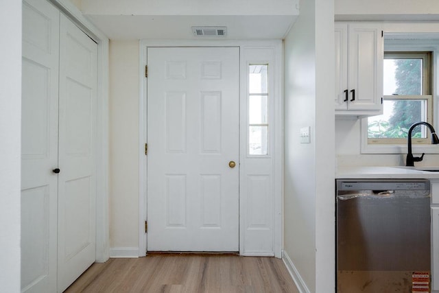 129 Fisherville Rd Unit 26, Concord, NH 03303 - foyer entrance with light wood-style flooring and baseboards