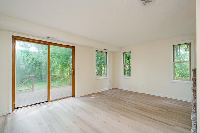 129 Fisherville Rd Unit 26, Concord, NH 03303 - empty room with light wood-type flooring and healthy amount of natural light