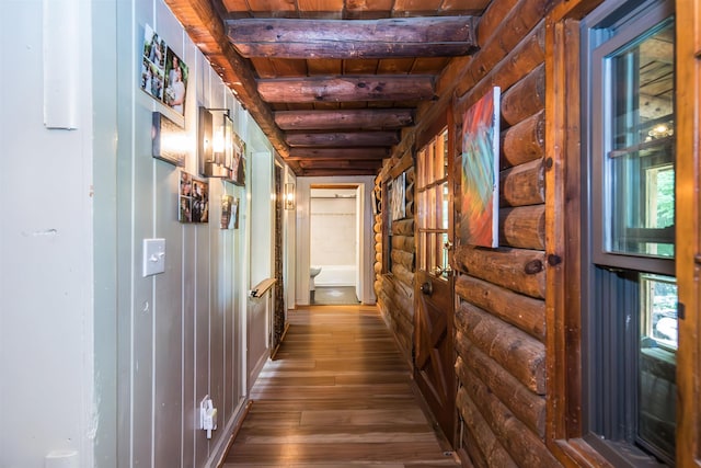 30 W Rd, Hubbardton, VT 05743 - hallway with dark wood-style floors, a wooden ceiling with exposed beams, rustic walls, and healthy amount of natural light