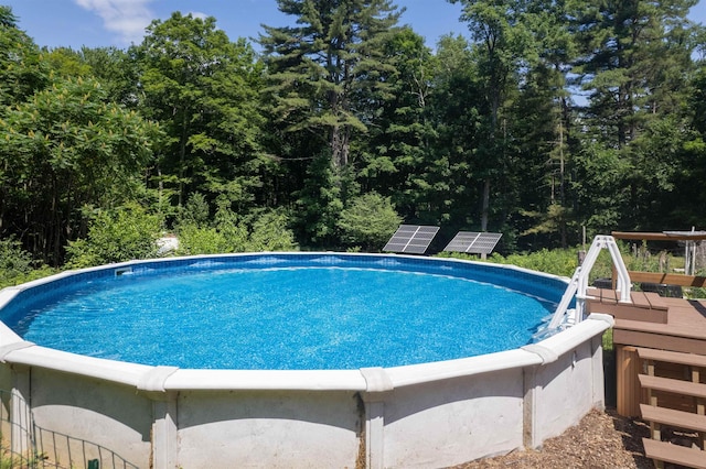 30 W Rd, Hubbardton, VT 05743 - swimming pool with a deck and a forest view