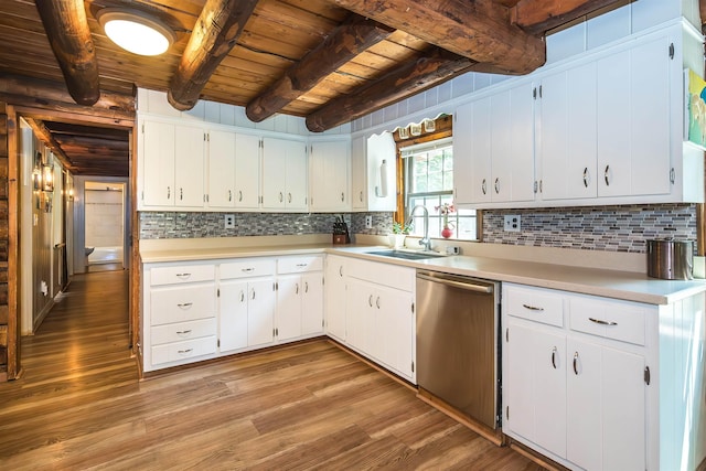 30 W Rd, Hubbardton, VT 05743 - kitchen with dishwasher, a wooden ceiling with exposed beams, light wood-style flooring, light countertops, and backsplash