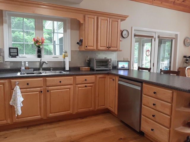 11 Captain Lovewell Ln, Ossipee, NH 03814 - kitchen with stainless steel dishwasher, a peninsula, light wood-style flooring, dark countertops, and backsplash