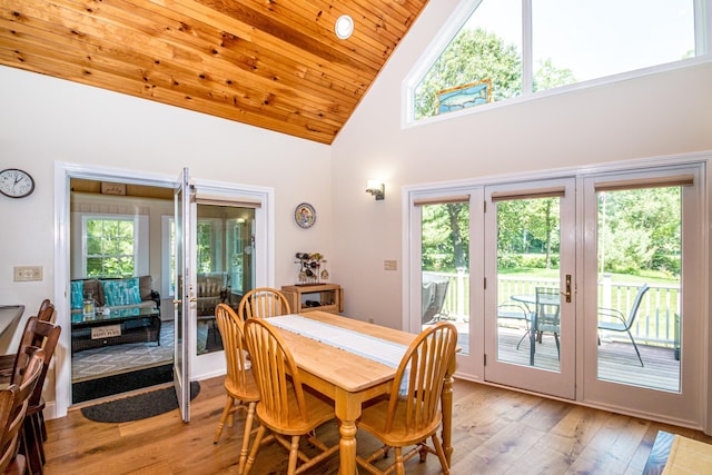 11 Captain Lovewell Ln, Ossipee, NH 03814 - dining area with light wood finished floors, french doors, high vaulted ceiling, and wooden ceiling