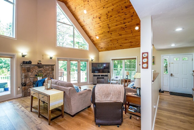 11 Captain Lovewell Ln, Ossipee, NH 03814 - living area featuring a fireplace, high vaulted ceiling, light wood-type flooring, recessed lighting, and wood ceiling
