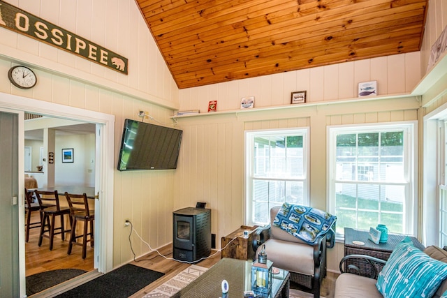 11 Captain Lovewell Ln, Ossipee, NH 03814 - living room featuring wood finished floors, a wood stove, vaulted ceiling, and wooden ceiling