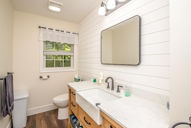 11 Captain Lovewell Ln, Ossipee, NH 03814 - bathroom with wood walls, vanity, and wood finished floors