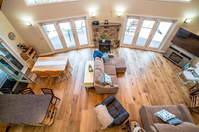 11 Captain Lovewell Ln, Ossipee, NH 03814 - living area featuring a wood stove and wood finished floors