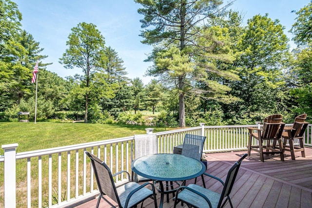 11 Captain Lovewell Ln, Ossipee, NH 03814 - wooden deck with a lawn, outdoor dining space, and view of scattered trees
