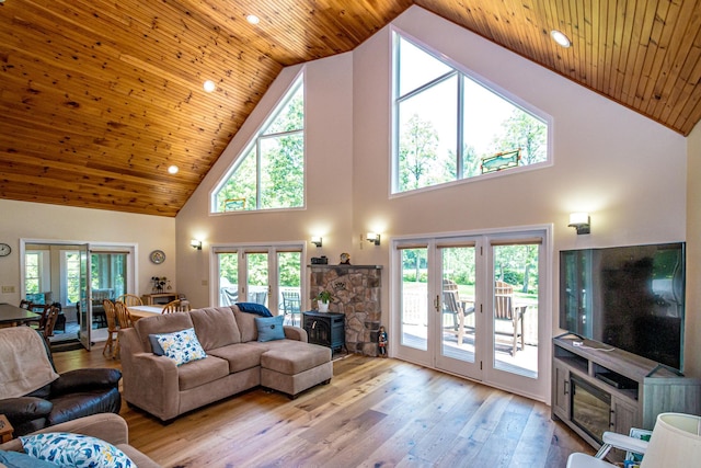 11 Captain Lovewell Ln, Ossipee, NH 03814 - living room featuring high vaulted ceiling, a wood stove, hardwood / wood-style floors, wooden ceiling, and french doors