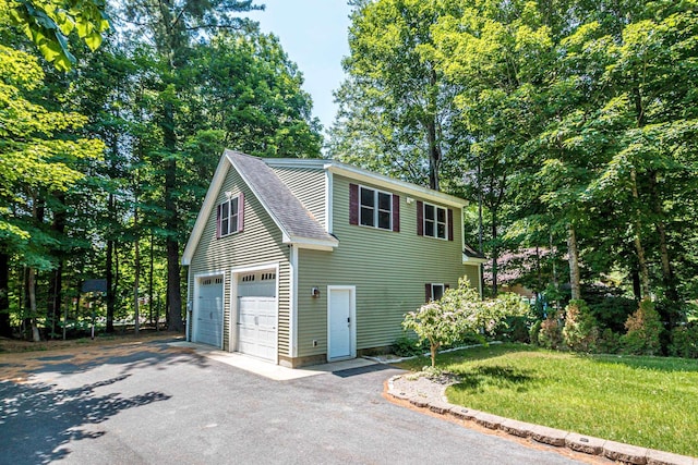 11 Captain Lovewell Ln, Ossipee, NH 03814 - view of front facade featuring driveway, roof with shingles, and a front lawn
