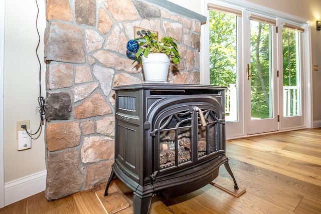 11 Captain Lovewell Ln, Ossipee, NH 03814 - detailed view of a wood stove and wood finished floors