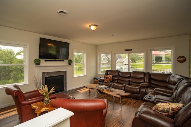 12 Encore Pl, Dover, VT 05356 - living area featuring healthy amount of natural light, a tile fireplace, and wood finished floors