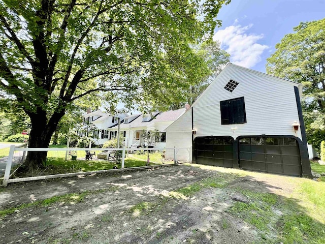 21 Main St, Rockingham, VT 05154 - view of front of home featuring driveway and an attached garage