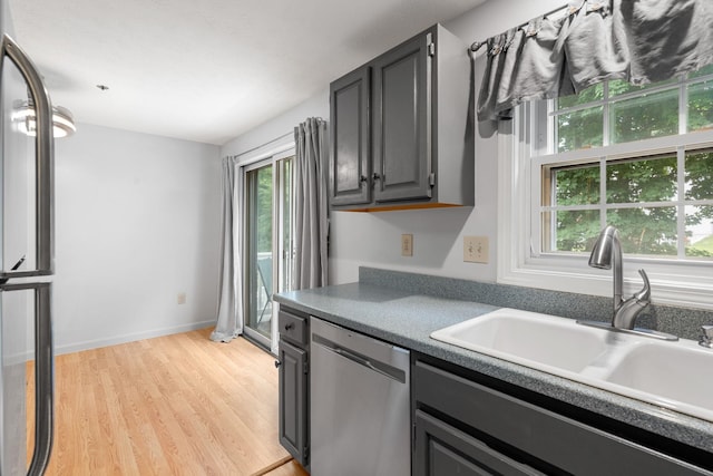 33 Beech Hill Ave, Manchester, NH 03103 - kitchen with stainless steel appliances, light wood-style flooring, and gray cabinetry