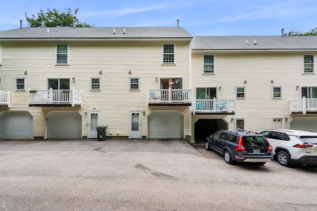 33 Beech Hill Ave, Manchester, NH 03103 - back of property with a garage and driveway