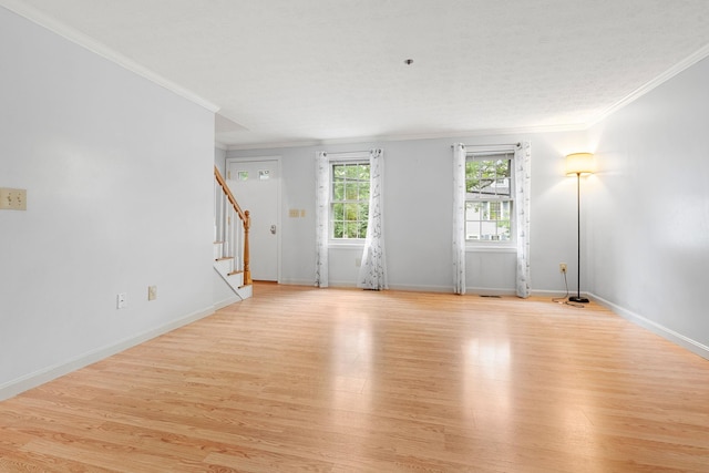 33 Beech Hill Ave, Manchester, NH 03103 - unfurnished living room with crown molding, stairs, and light wood-type flooring