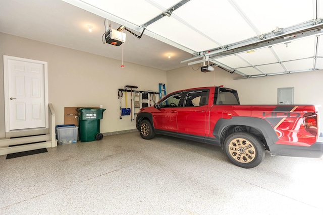 25 Reserve Way Unit 60, Milford, NH 03055 - garage featuring a garage door opener and electric panel