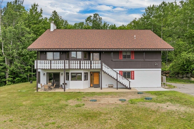 F22 Christmas Mountain Rd Unit 22, Bartlett, NH 03812 - rear view of house featuring a patio, a yard, stairway, a chimney, and a shingled roof