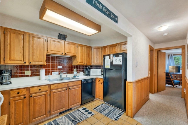 F22 Christmas Mountain Rd Unit 22, Bartlett, NH 03812 - kitchen featuring black appliances, light countertops, decorative backsplash, wainscoting, and light tile patterned floors