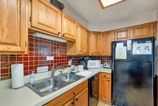 F22 Christmas Mountain Rd Unit 22, Bartlett, NH 03812 - kitchen with black appliances, light countertops, decorative backsplash, and brown cabinets
