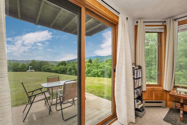 F22 Christmas Mountain Rd Unit 22, Bartlett, NH 03812 - doorway featuring a baseboard radiator, a mountain view, and carpet