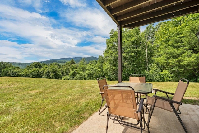 F22 Christmas Mountain Rd Unit 22, Bartlett, NH 03812 - view of patio / terrace with a forest view and outdoor dining area