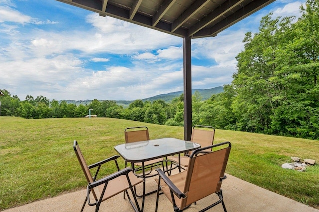 F22 Christmas Mountain Rd Unit 22, Bartlett, NH 03812 - view of patio featuring outdoor dining area and a mountain view