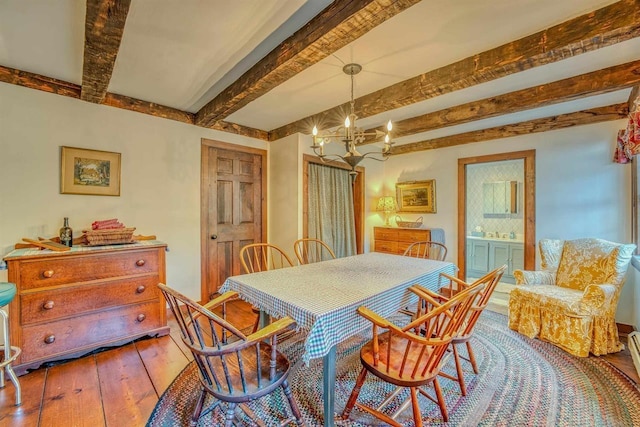 3247 Rte 302, Lisbon, NH 03585 - dining space with a chandelier, hardwood / wood-style flooring, and beamed ceiling