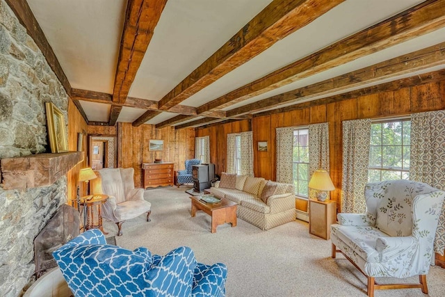 3247 Rte 302, Lisbon, NH 03585 - living room with beamed ceiling, carpet flooring, a baseboard radiator, and wood walls