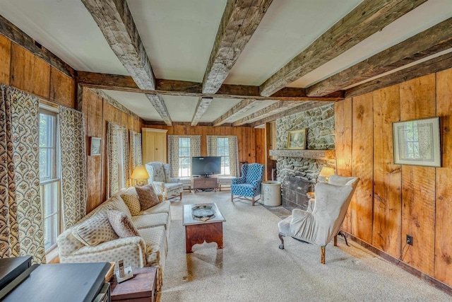 3247 Rte 302, Lisbon, NH 03585 - carpeted living room with wood walls, beamed ceiling, and a fireplace