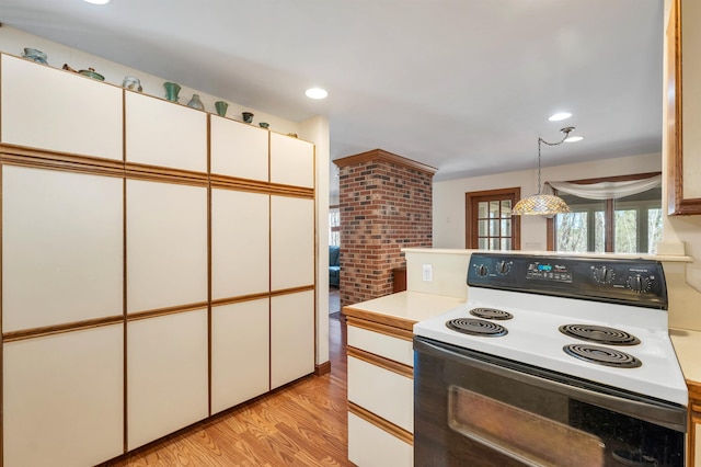 107 Peaked Hill Rd, Hopkinton, NH 03229 - kitchen with range with electric cooktop, light countertops, light wood-style flooring, white cabinetry, and recessed lighting