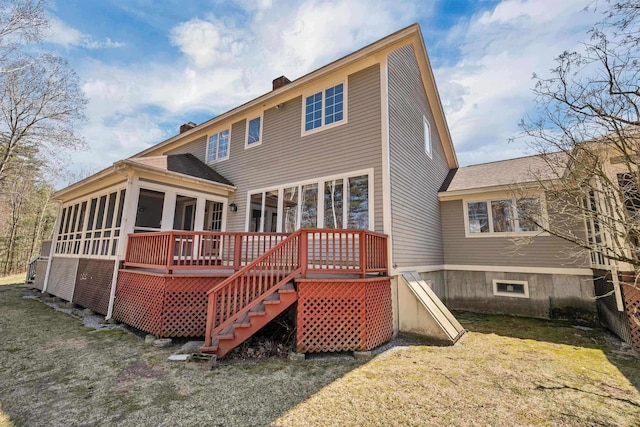 107 Peaked Hill Rd, Hopkinton, NH 03229 - rear view of property featuring a sunroom, a chimney, a deck, stairway, and a lawn