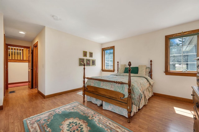 107 Peaked Hill Rd, Hopkinton, NH 03229 - bedroom with multiple windows, light wood-style floors, and recessed lighting