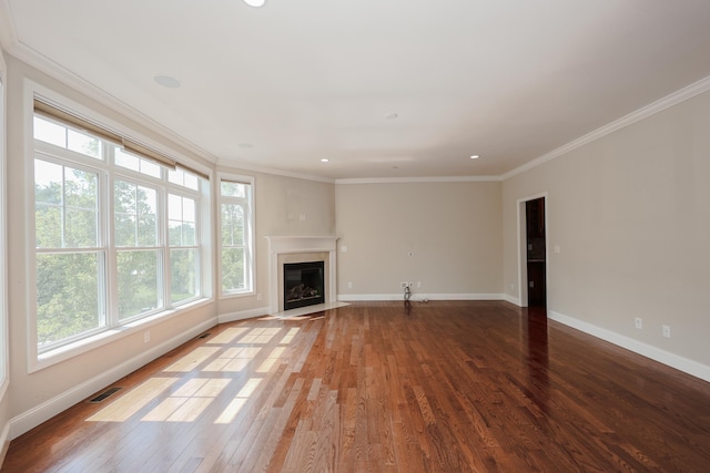 2C Manor Dr, Hooksett, NH 03106 - unfurnished living room featuring wood finished floors, ornamental molding, a fireplace with flush hearth, and recessed lighting