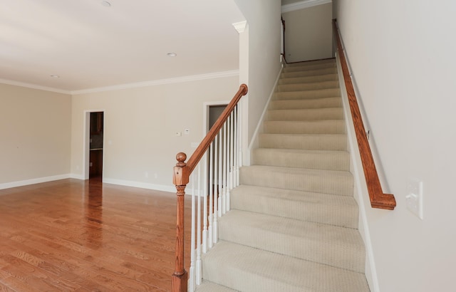 2C Manor Dr, Hooksett, NH 03106 - stairs with wood finished floors, crown molding, and arched walkways
