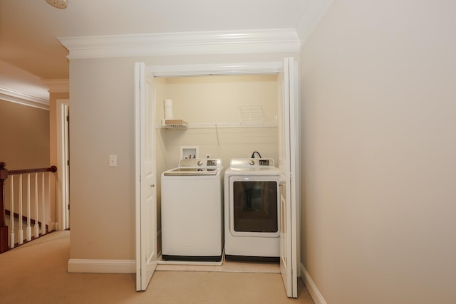 2C Manor Dr, Hooksett, NH 03106 - laundry room with crown molding, washing machine and clothes dryer, and light carpet