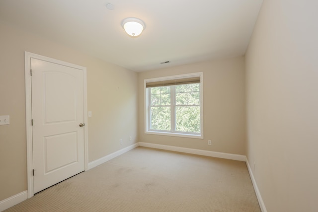 2C Manor Dr, Hooksett, NH 03106 - spare room with baseboards and light carpet