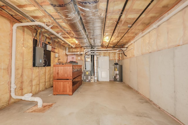 2C Manor Dr, Hooksett, NH 03106 - unfinished below grade area featuring gas water heater, electric panel, and heating unit