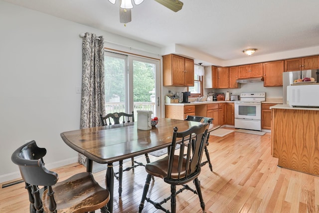 22 Pelham Rd, Hudson, NH 03051 - dining area with a ceiling fan and light wood finished floors