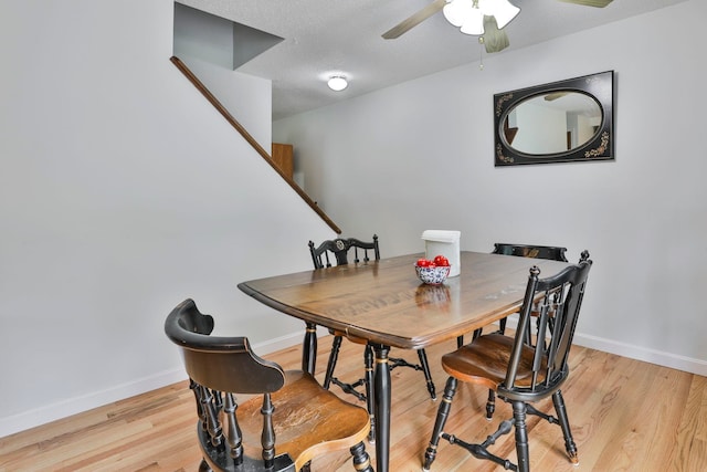 22 Pelham Rd, Hudson, NH 03051 - dining area featuring ceiling fan, light wood finished floors, stairway, and a textured ceiling