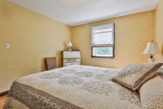 22 Pelham Rd, Hudson, NH 03051 - bedroom with wood finished floors and a textured ceiling