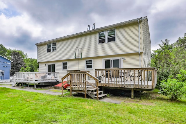 22 Pelham Rd, Hudson, NH 03051 - rear view of house with a wooden deck and a yard