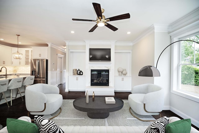 50 Newfields Rd Unit A, Exeter, NH 03833 - living area featuring crown molding, a ceiling fan, a premium fireplace, dark wood finished floors, and recessed lighting